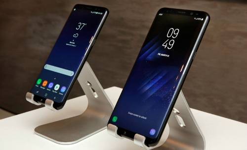 New Samsung S8, left, and S8+ mobile phones are displayed in New York,  Friday, March 24, 2017. (AP Photo/Richard Drew)